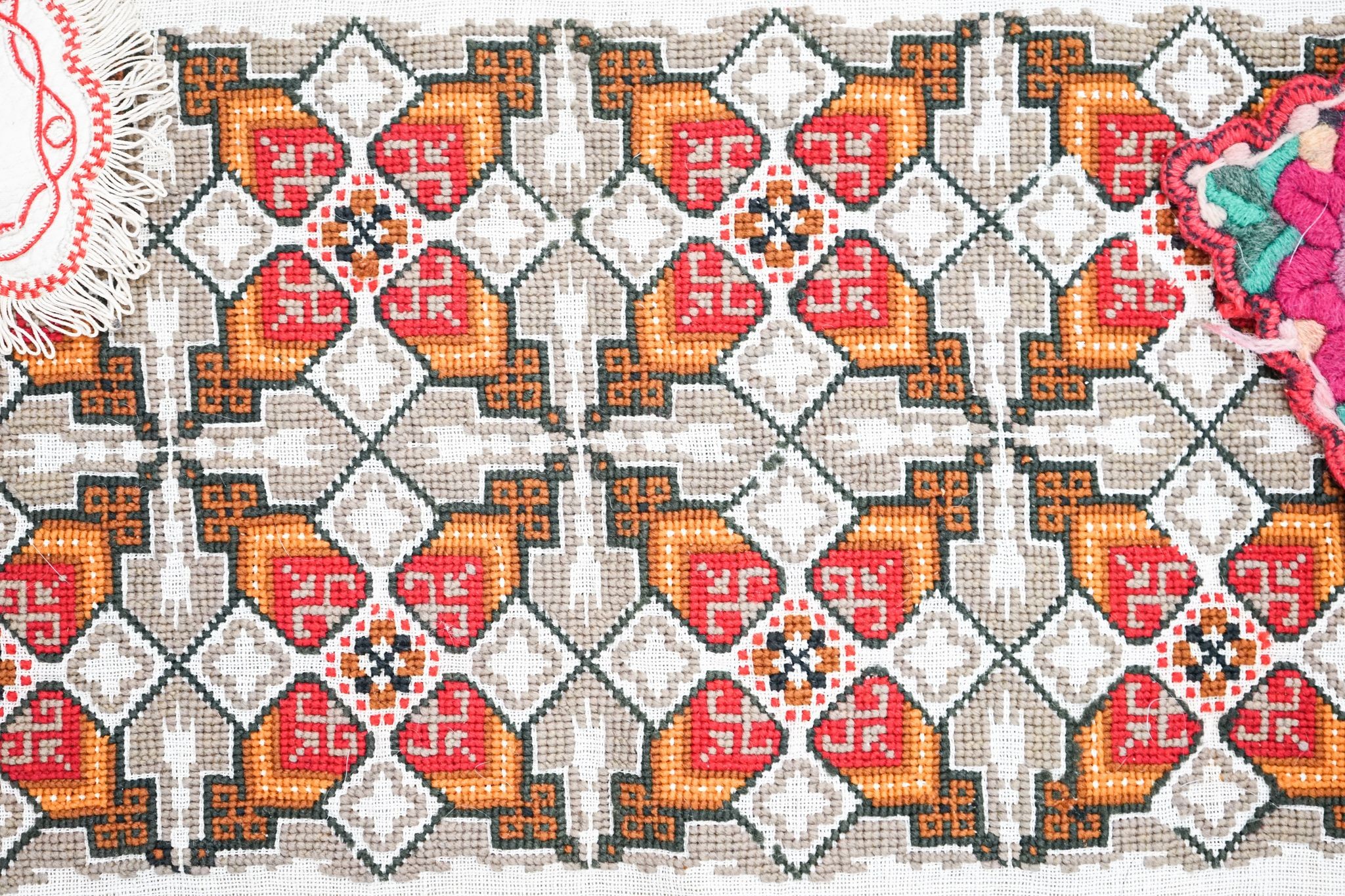 A Berlin beadwork tray panel, an Indian embroidered cloth etc.